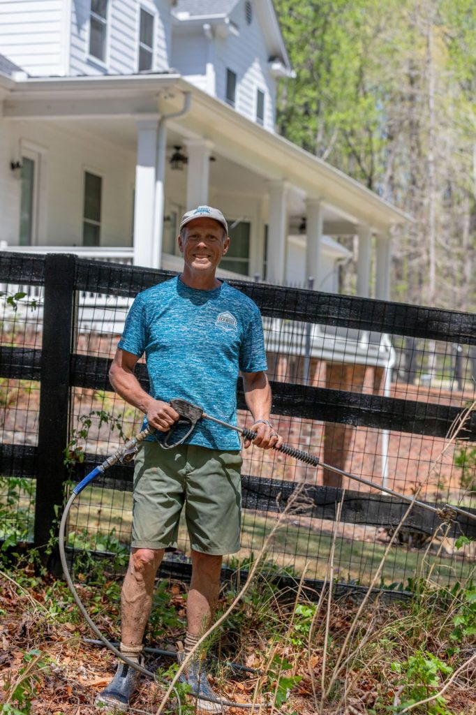 Jim Lockwood pressure washing at a home in Cumming, Georgia